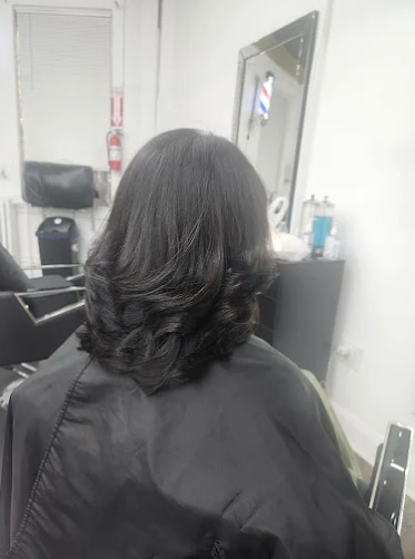 Long layered haircut with curls at Hair Design salon in Norwalk CT